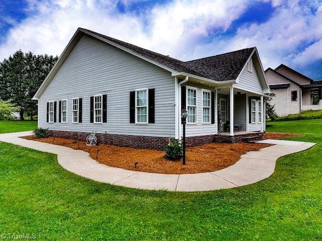 525 Bennett St, Mount Airy, NC 27030 - view of property exterior featuring covered porch and a yard