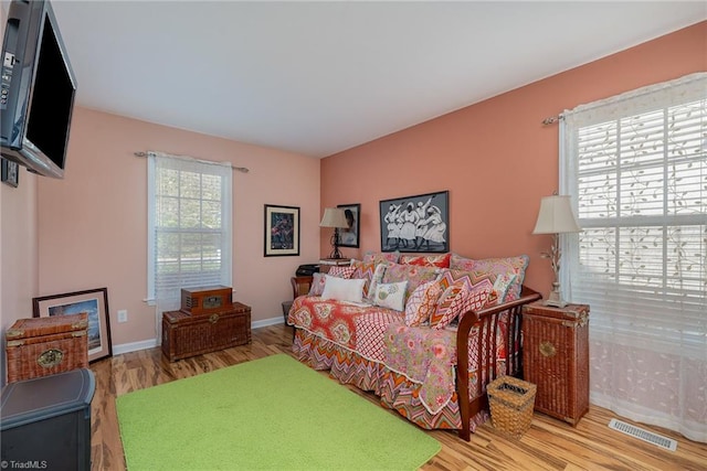 bedroom with hardwood / wood-style floors