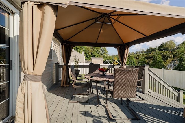 wooden deck featuring a gazebo