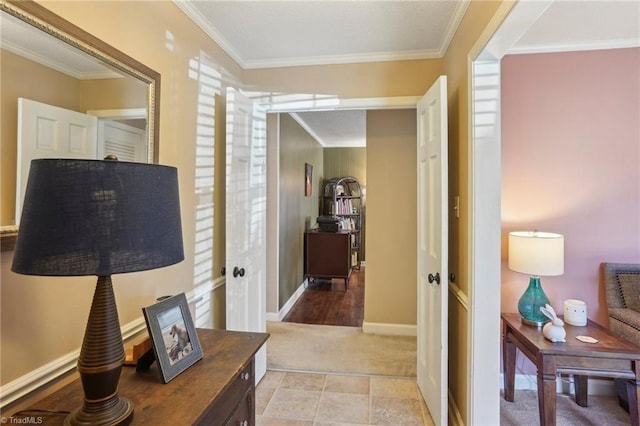 hallway featuring crown molding and light colored carpet