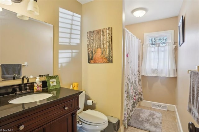 bathroom featuring vanity, curtained shower, tile patterned floors, and toilet