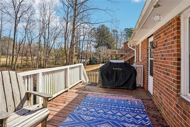 wooden deck with grilling area