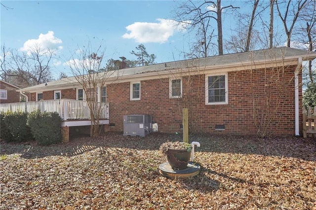 rear view of house with a wooden deck