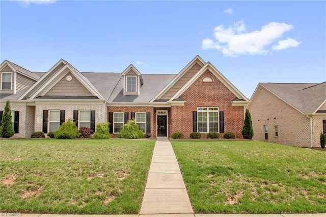1442 Crestlawn Trl, Pfafftown, NC 27040 - view of front facade with brick siding and a front lawn