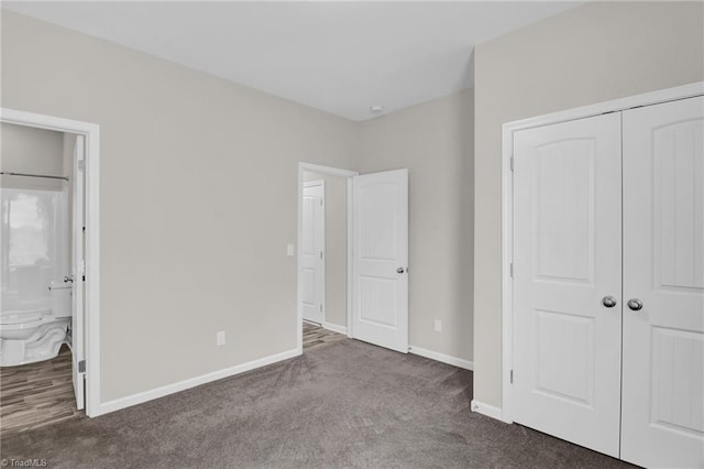 1442 Crestlawn Trl, Pfafftown, NC 27040 - unfurnished bedroom with a closet, carpet flooring, baseboards, and ensuite bathroom
