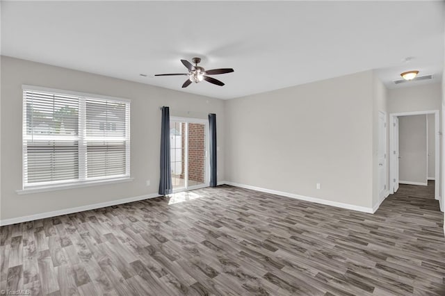 1442 Crestlawn Trl, Pfafftown, NC 27040 - unfurnished room with visible vents, baseboards, a ceiling fan, and wood finished floors