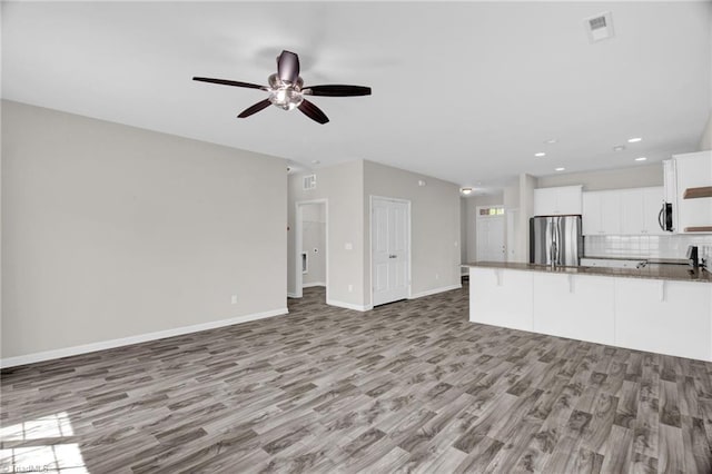1442 Crestlawn Trl, Pfafftown, NC 27040 - unfurnished living room with visible vents, baseboards, a ceiling fan, light wood finished floors, and recessed lighting
