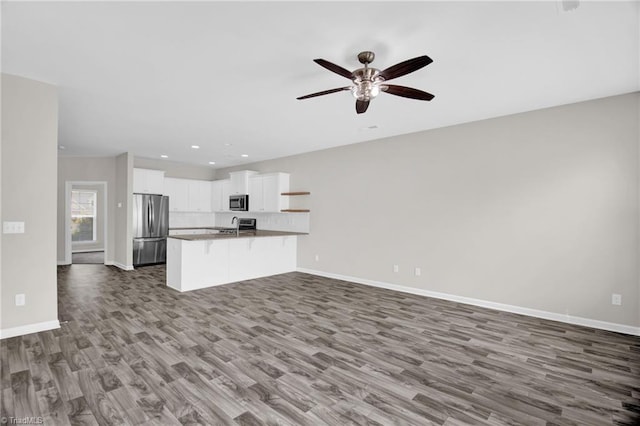 1442 Crestlawn Trl, Pfafftown, NC 27040 - unfurnished living room featuring dark wood-type flooring, baseboards, a ceiling fan, and recessed lighting