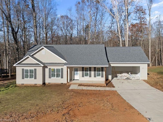 single story home featuring a garage and a front lawn