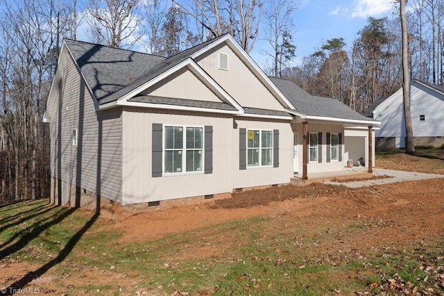 view of front of house with covered porch and a front yard