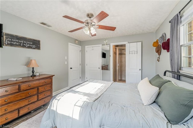 bedroom featuring visible vents and a ceiling fan