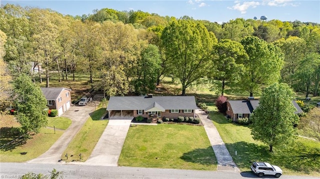 drone / aerial view featuring a forest view