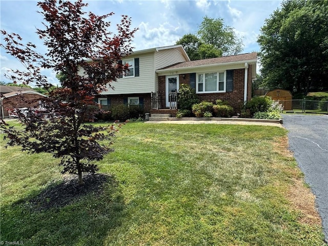 split level home featuring a front lawn