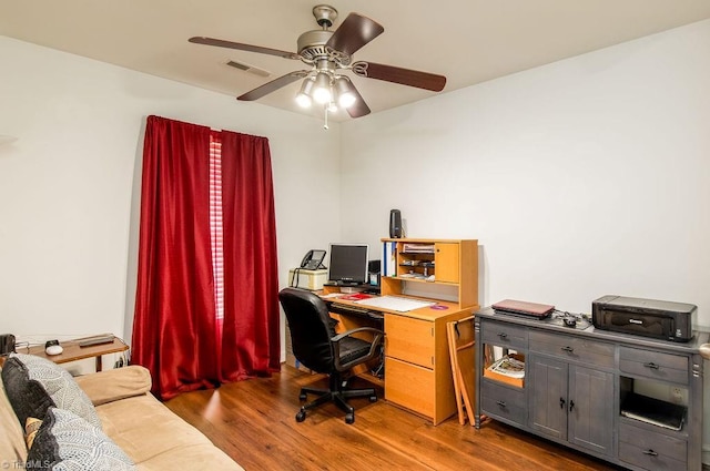 office with wood finished floors, visible vents, and a ceiling fan