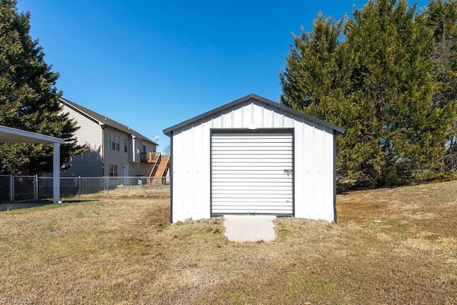 garage with fence