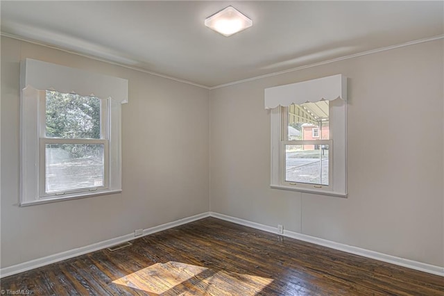 unfurnished room with dark hardwood / wood-style floors and crown molding