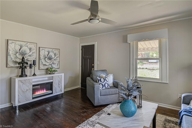 living room with ceiling fan, crown molding, dark hardwood / wood-style flooring, and a high end fireplace