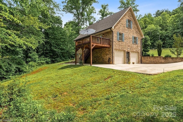 845 Montgomery Ct, Walnut Cove, NC 27052 - view of property exterior featuring driveway, a deck, a garage, stairway, and a yard