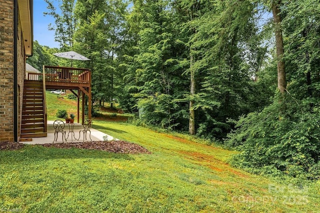 845 Montgomery Ct, Walnut Cove, NC 27052 - view of grassy yard featuring stairway, a patio area, and a deck