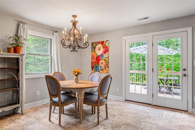 845 Montgomery Ct, Walnut Cove, NC 27052 - dining area with a chandelier, baseboards, and plenty of natural light