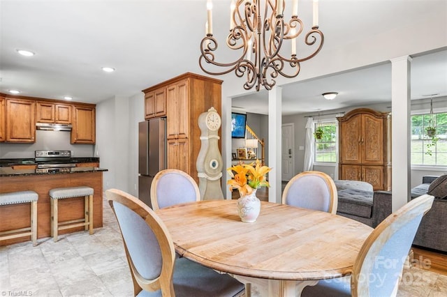 845 Montgomery Ct, Walnut Cove, NC 27052 - dining room with healthy amount of natural light, recessed lighting, a chandelier, and stairs