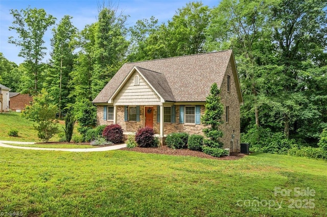 845 Montgomery Ct, Walnut Cove, NC 27052 - view of front of home with a front yard, central AC unit, and brick siding
