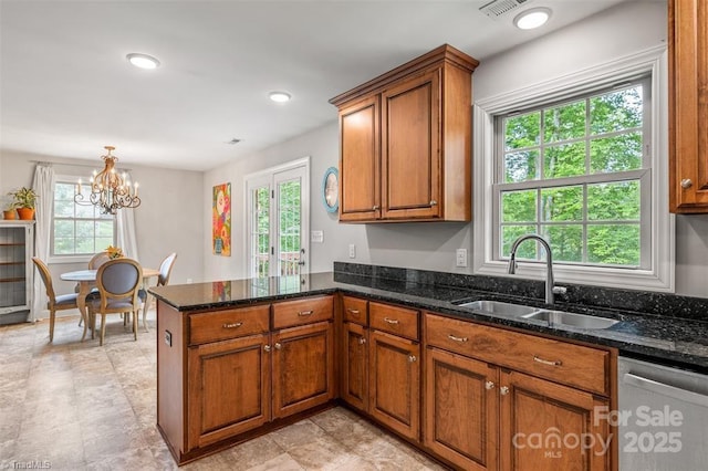 845 Montgomery Ct, Walnut Cove, NC 27052 - kitchen featuring dishwasher, a sink, healthy amount of natural light, brown cabinets, and recessed lighting