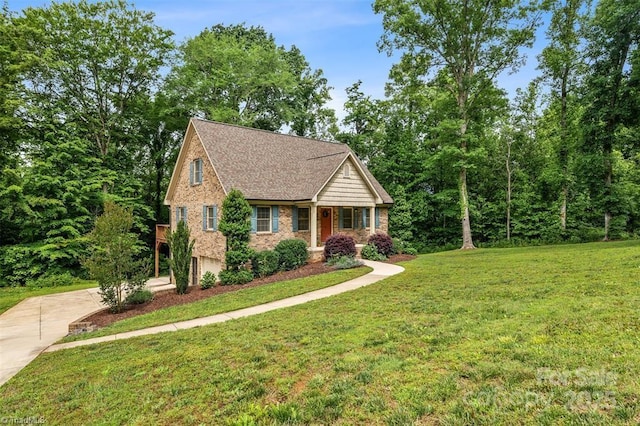 845 Montgomery Ct, Walnut Cove, NC 27052 - view of front of property with concrete driveway, brick siding, a front lawn, a garage, and roof with shingles