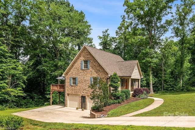 845 Montgomery Ct, Walnut Cove, NC 27052 - view of side of home featuring an attached garage, brick siding, driveway, a lawn, and roof with shingles