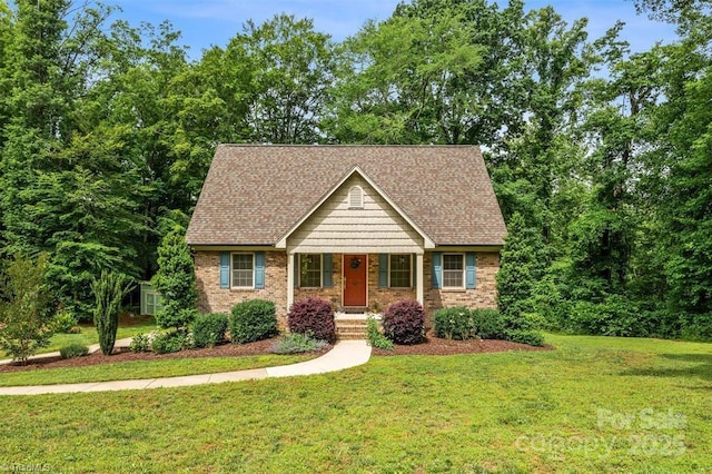845 Montgomery Ct, Walnut Cove, NC 27052 - view of front of property with a front yard, roof with shingles, and covered porch