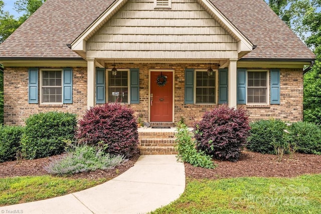 845 Montgomery Ct, Walnut Cove, NC 27052 - view of front of property with brick siding and roof with shingles