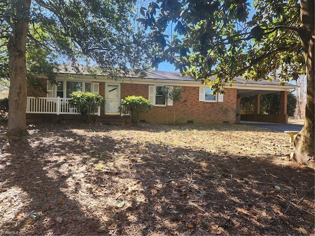 single story home featuring a carport