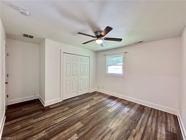 1101 Forrest St, High Point, NC 27262 - unfurnished bedroom with dark wood-style floors, baseboards, and a closet
