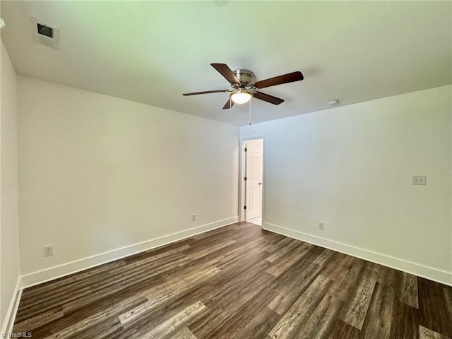 1101 Forrest St, High Point, NC 27262 - spare room featuring dark wood-style flooring, baseboards, and ceiling fan