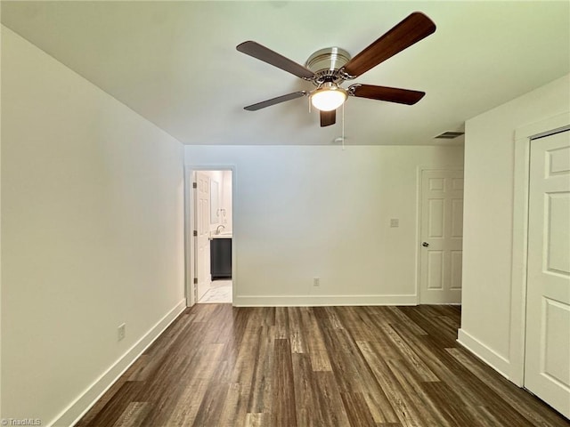1101 Forrest St, High Point, NC 27262 - unfurnished room with dark wood-style flooring, baseboards, and a ceiling fan