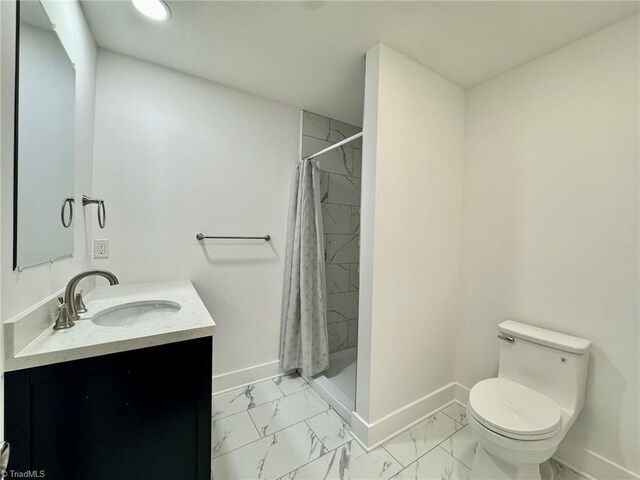 1101 Forrest St, High Point, NC 27262 - bathroom featuring marble finish flooring, baseboards, vanity, and toilet