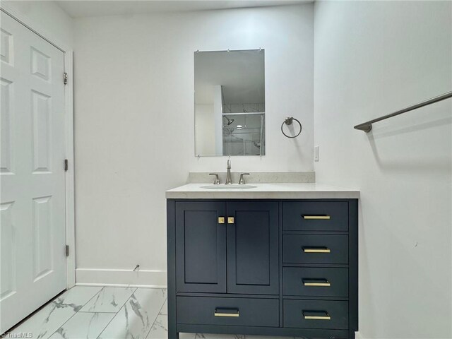 1101 Forrest St, High Point, NC 27262 - bathroom featuring marble look tiles, vanity, baseboards, and a shower