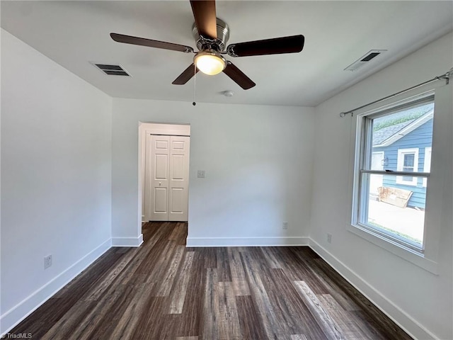 1101 Forrest St, High Point, NC 27262 - empty room featuring dark wood-type flooring, baseboards, and ceiling fan