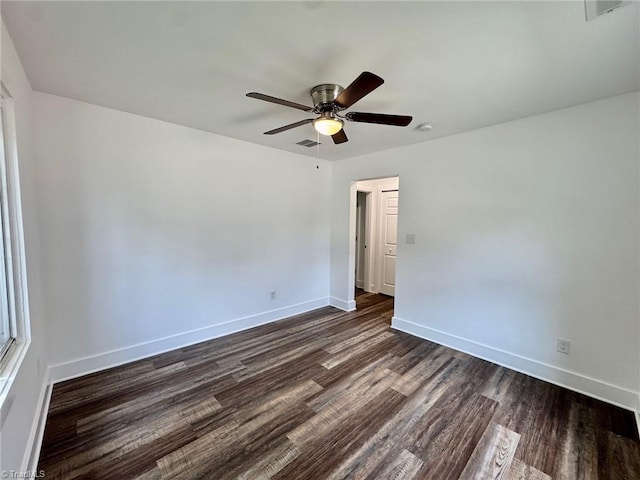1101 Forrest St, High Point, NC 27262 - empty room with a ceiling fan, dark wood-style floors, and baseboards