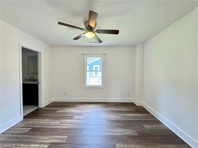 1101 Forrest St, High Point, NC 27262 - unfurnished room with a ceiling fan, dark wood-style floors, and baseboards