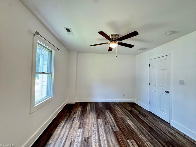 1101 Forrest St, High Point, NC 27262 - unfurnished room featuring dark wood-style floors, baseboards, and a ceiling fan