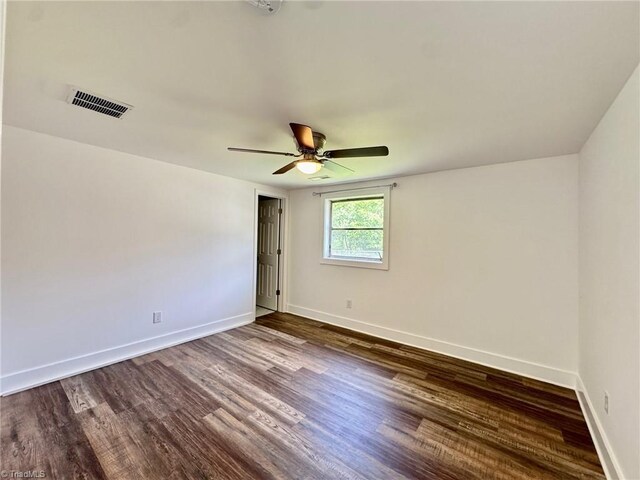1101 Forrest St, High Point, NC 27262 - empty room featuring dark wood finished floors, baseboards, and a ceiling fan