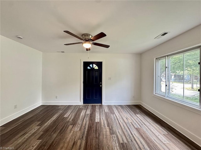 1101 Forrest St, High Point, NC 27262 - empty room featuring dark wood-style floors, baseboards, ceiling fan, and a smoke detector