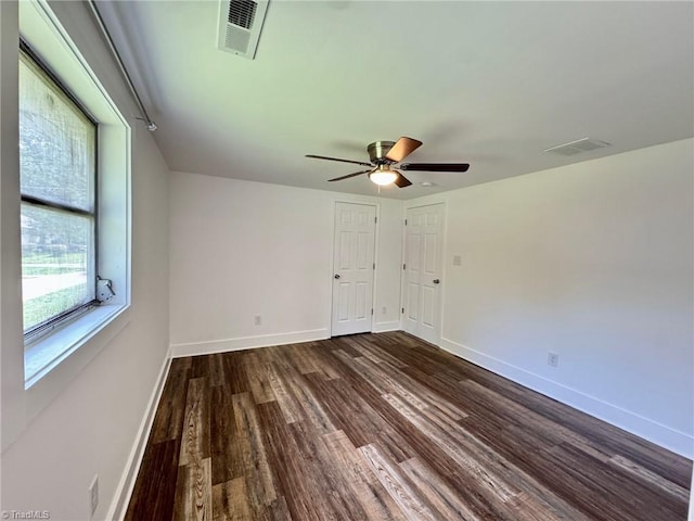 1101 Forrest St, High Point, NC 27262 - spare room with dark wood-type flooring, baseboards, and a ceiling fan