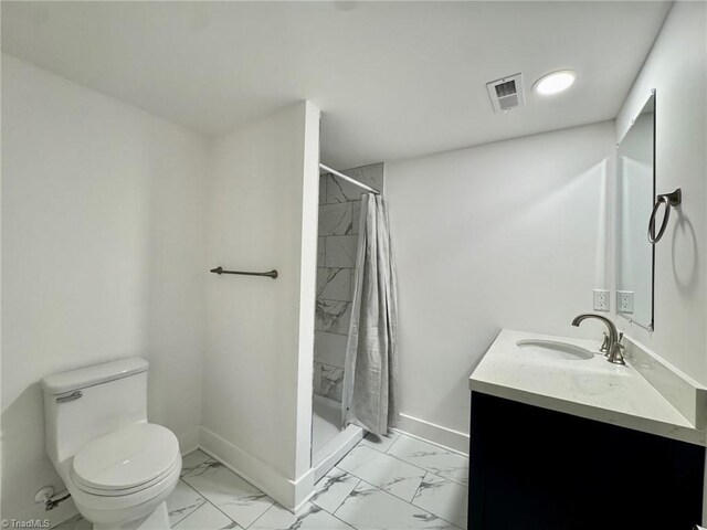 1101 Forrest St, High Point, NC 27262 - bathroom with vanity, marble look tiles, toilet, and baseboards