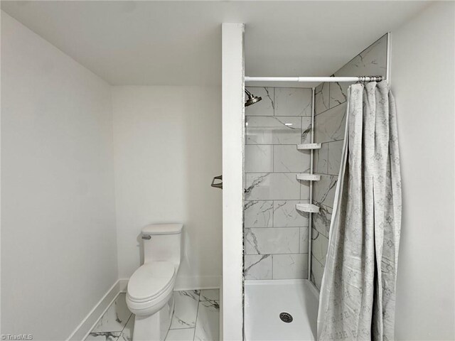 1101 Forrest St, High Point, NC 27262 - full bathroom featuring marble look tile flooring, baseboards, toilet, and a shower stall