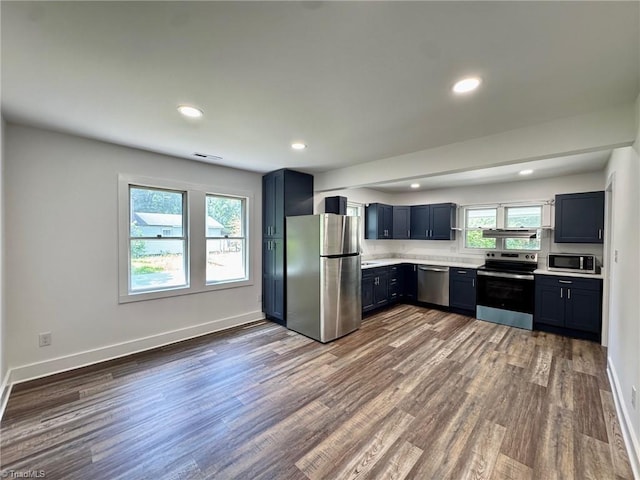 1101 Forrest St, High Point, NC 27262 - kitchen featuring stainless steel appliances, light countertops, dark wood-style flooring, baseboards, and recessed lighting