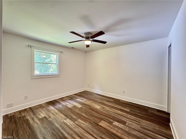 1101 Forrest St, High Point, NC 27262 - spare room featuring dark wood-style floors, a ceiling fan, and baseboards