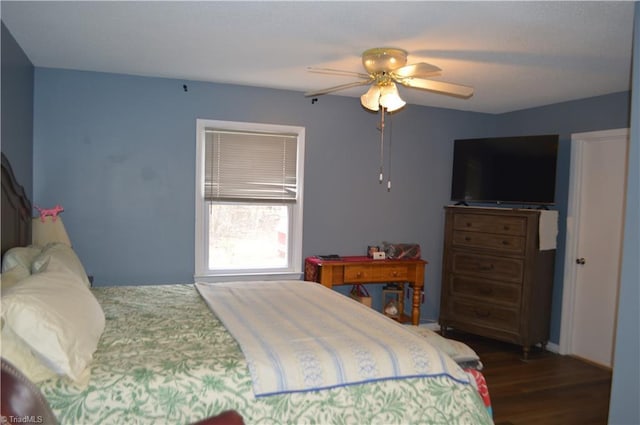 bedroom featuring dark hardwood / wood-style floors and ceiling fan