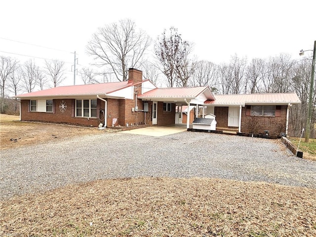 single story home with a carport